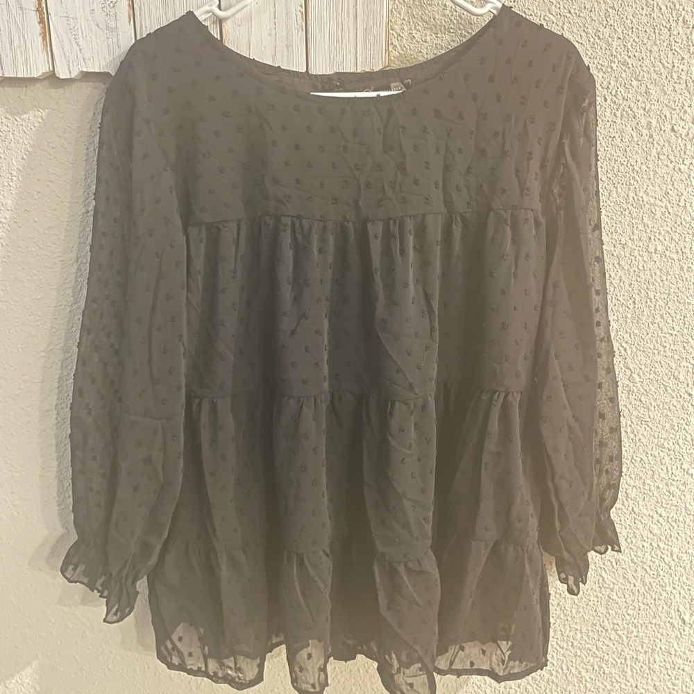 Black sheer blouse.